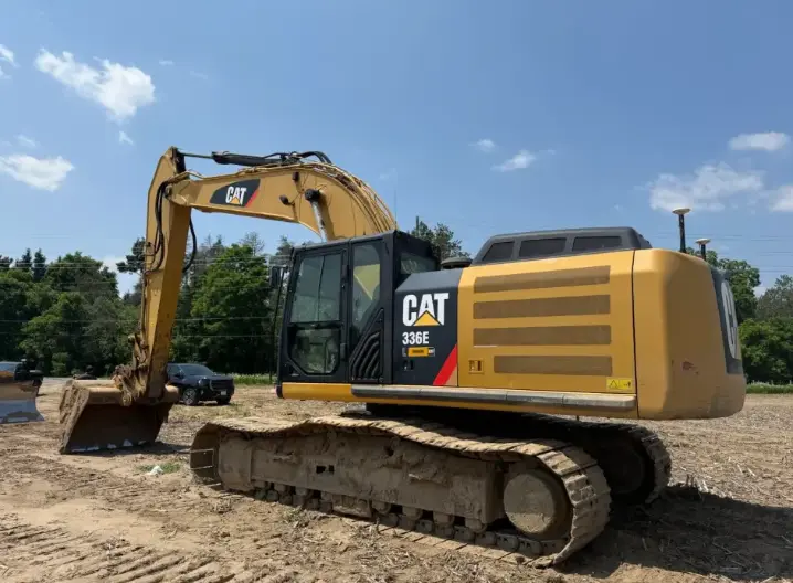 CAT 336E excavator equipped with FJD G31 PRO 3D Guidance System digging precise trenches on Vaughan construction site